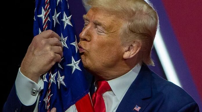 Donald Trump desecrating the American Flag